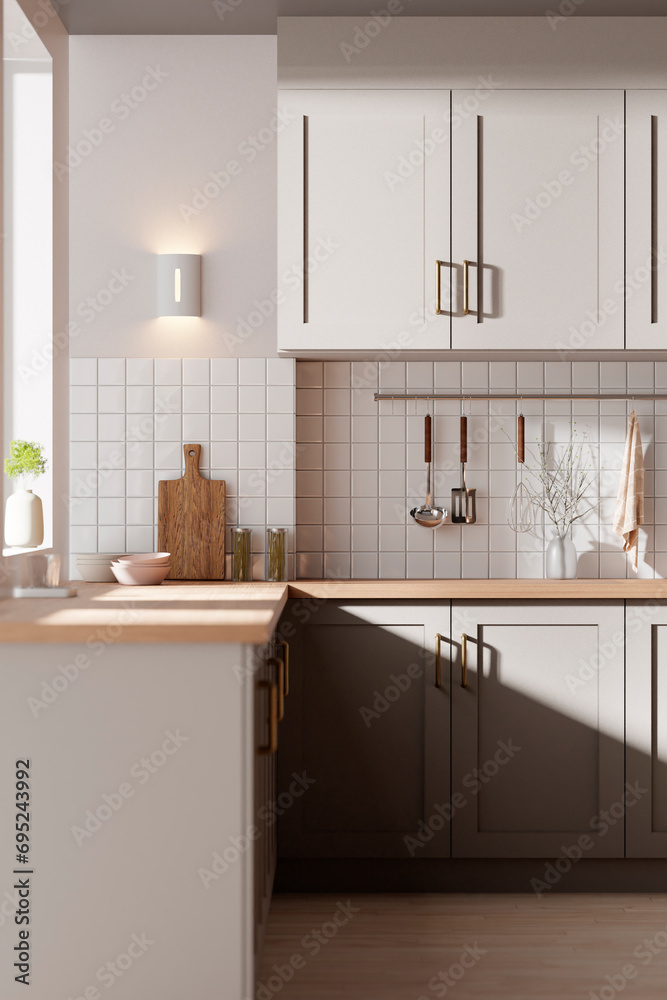 Fototapeta premium A bright beige-toned kitchen interior with sunlight coming through the window.