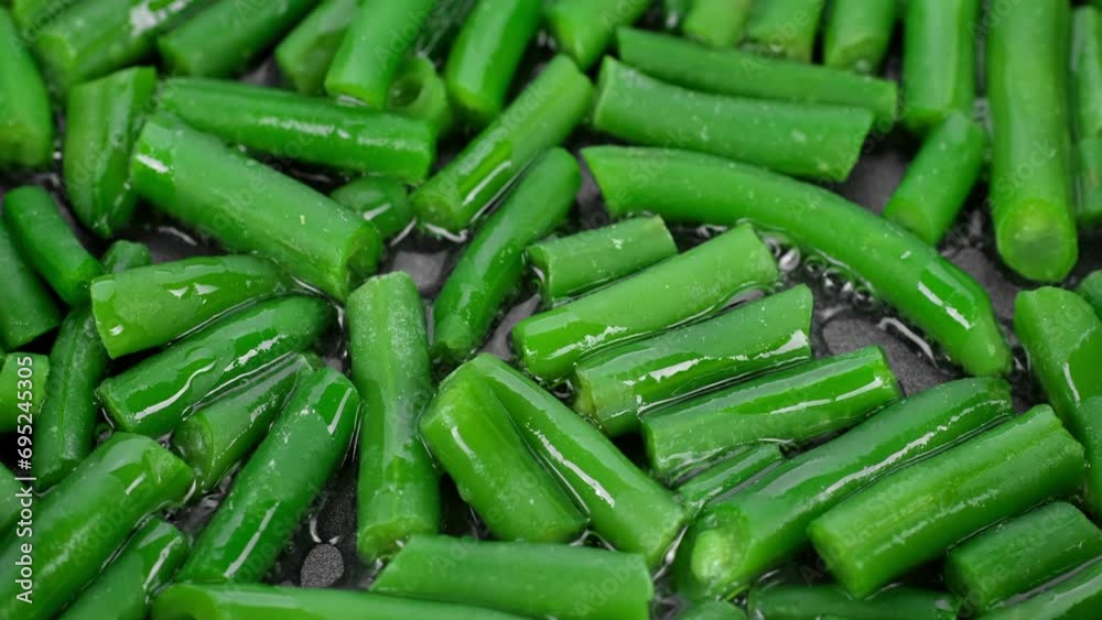 Cooking green beans in frying pan. Healthy vegan food concept Cooking green beans in frying pan. Healthy vegan food concept