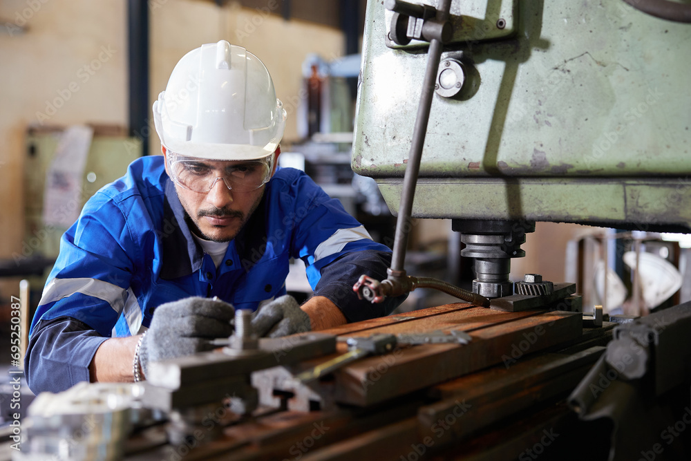 factory worker or technician checking and control lathe machine in factory factory worker or technician checking and control lathe machine in factory