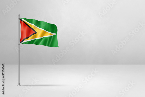 Guyanese flag isolated on white concrete wall background photo