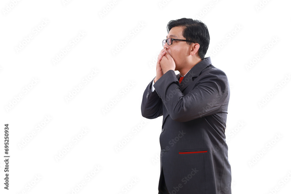 Side view of Shocked asian business man standing while covering his mouth. Isolated on white Side view of Shocked asian business man standing while covering his mouth. Isolated on white