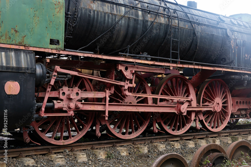 Transmission system of an old train. Traction wheels of a steam train