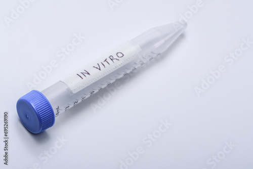 Vial with the in vitro inscription on a light background