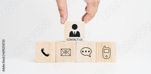 contact us icon on wood cube, Customer service and business contact concept, telephone email address on white background.
