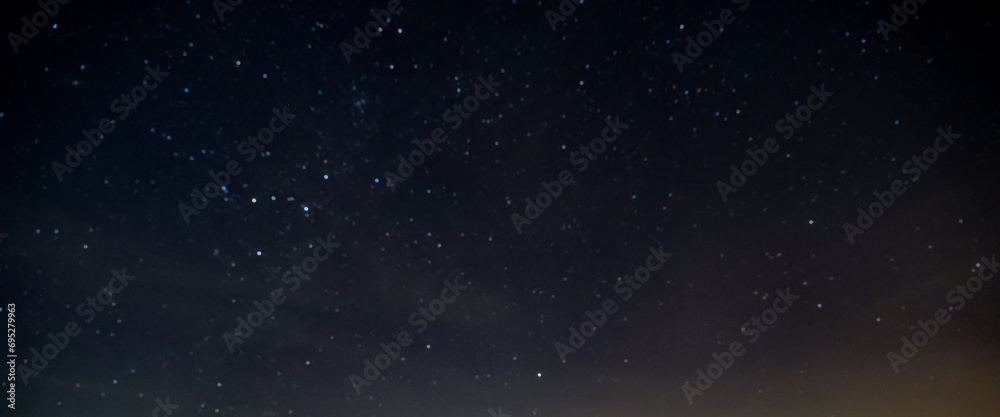 star in space with blur dark sky background at night