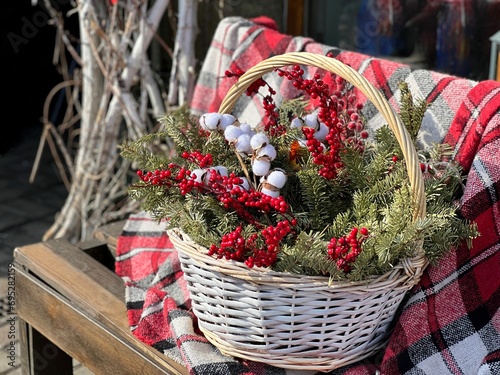 Christmas winter bouquet composition spruce tree branches, cotton flowers, red berries.  photo