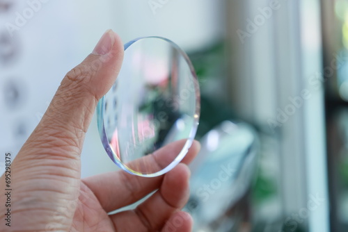 close up of hand holding glasses