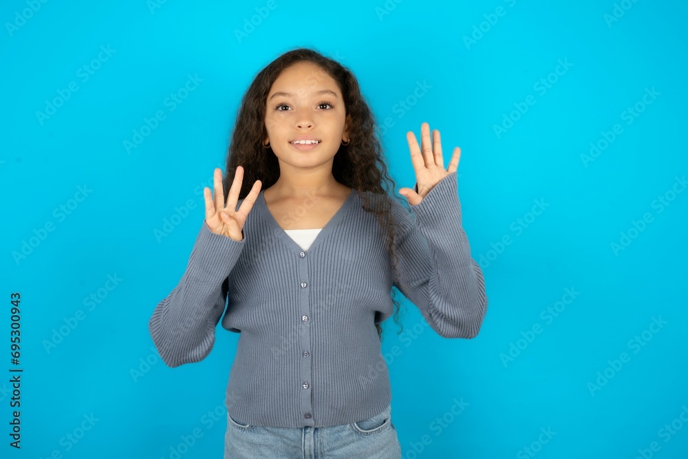 Beautiful teenager girl showing and pointing up with fingers number nine while smiling confident and happy. Beautiful teenager girl showing and pointing up with fingers number nine while smiling confident and happy.
