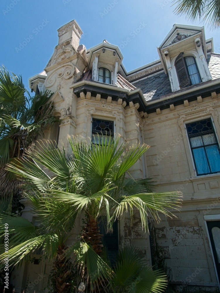 Fototapeta premium Detail view of historic 19th century building with roof turrets in Galveston, Texas.