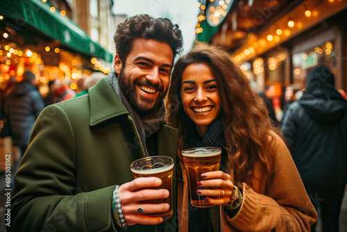 Happy couple toasting with beer on St. Patrick's Day