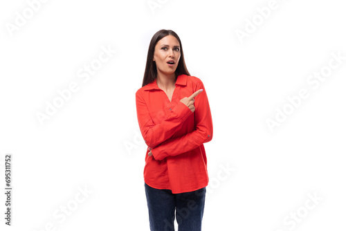 young charming brunette employee woman dressed in a red loose shirt gesturing on a white background