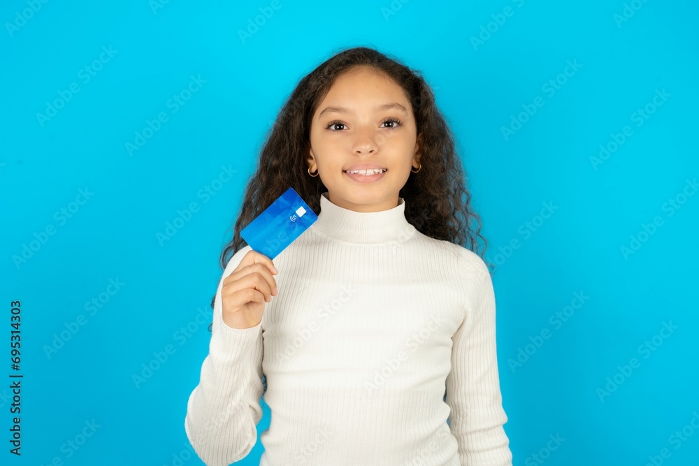 Photo of happy cheerful smiling positive Young beautiful teen girl recommend credit card Photo of happy cheerful smiling positive Young beautiful teen girl recommend credit card