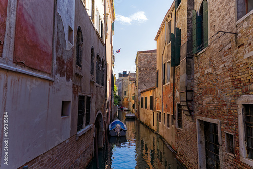 Old town of Italian City of Venice with scenic view of canal with moored boats on a sunny summer day. Photo taken August 7th, 2023, Venice, Italy. © Michael Derrer Fuchs