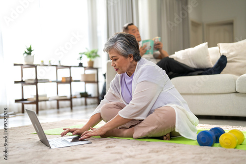 Portrait of sport senior asian woman training and sitting relax practicing yoga, elderly health, fitness, exercise, wellness, workout, sport at home.retirement concept.Fitness,senior healthy lifestyle