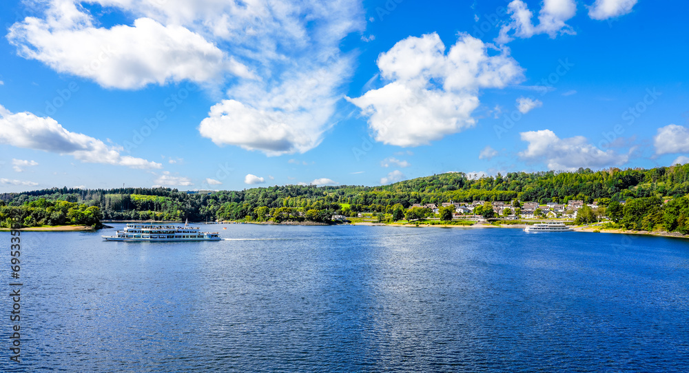 View of the Biggesee near Attendorn in the Olpe district with the surrounding nature. Landscape by the lake in the Sauerland. Bigge Dam.
View of the Biggesee near Attendorn in the Olpe district with the surrounding nature. Landscape by the lake in the Sauerland. Bigge Dam.