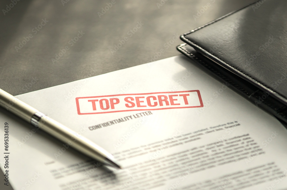 Top secret document on the table. Confidentiality letter on the desk. - obrazy, fototapety, plakaty 