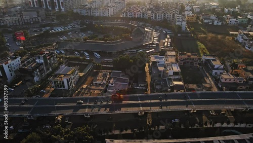 Aerial footage of the bustling Indian city Dehradun, showcasing moving traffic on the flyover near ISBT, Dehradun, Uttarakhand, India. photo