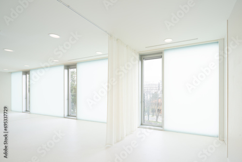 White room with glass windows and curtain in hospital