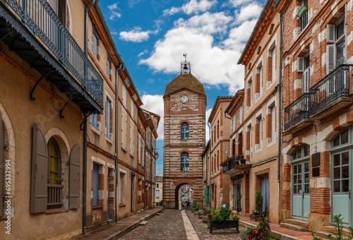 Medieval village of Auvillar and its clock tower, in Tarn et Garonne, Occitanie, France photo