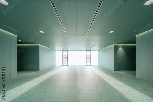 Empty green room with closed glass door in modern hospital photo