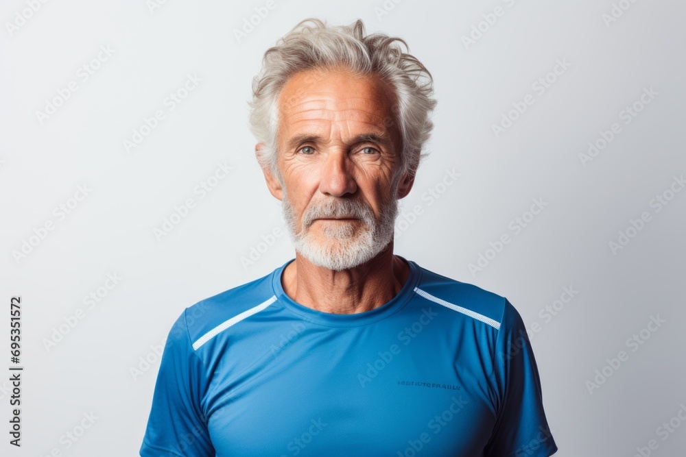 Portrait of a content man in his 60s sporting a breathable mesh jersey against a white background. AI Generation Portrait of a content man in his 60s sporting a breathable mesh jersey against a white background. AI Generation
