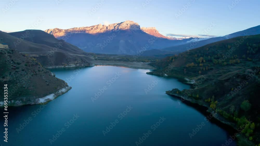 Mountain lake with blue water in a picturesque gorge. Landscape and nature of the North Caucasus Mountain lake with blue water in a picturesque gorge. Landscape and nature of the North Caucasus