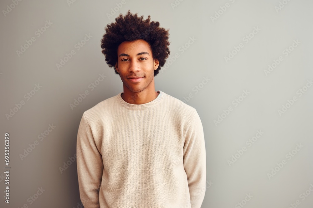 Portrait of a tender afro-american man in his 20s wearing a cozy sweater against a modern minimalist interior. AI Generation Portrait of a tender afro-american man in his 20s wearing a cozy sweater against a modern minimalist interior. AI Generation