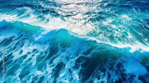 Top view background photo of ocean sea water. White wave splashing in the deep sea.