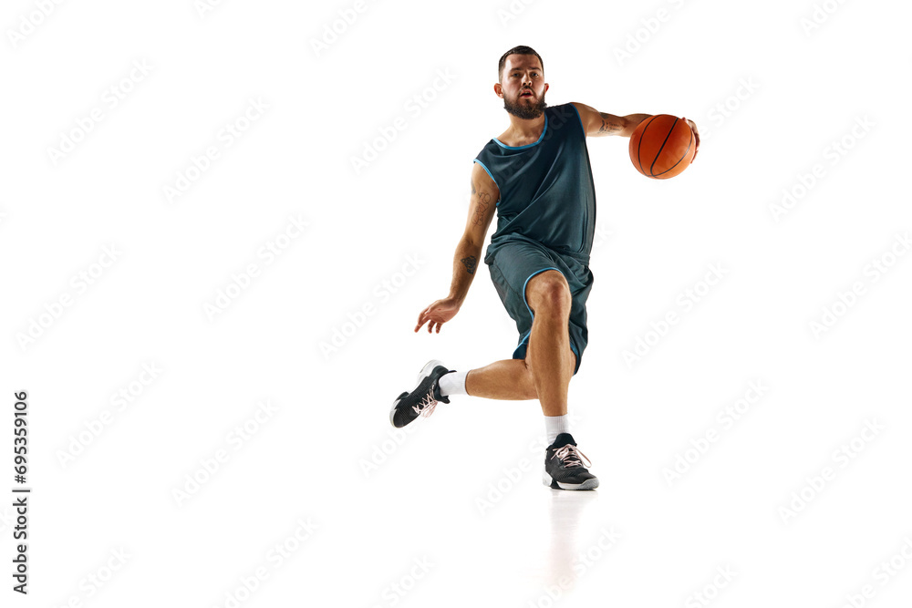 Intense concentration of basketball player during training session, emphasizing commitment to excellence against white background.