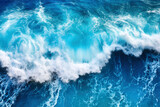 Top view background photo of ocean sea water. White wave splashing in the deep sea.