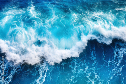 Top view background photo of ocean sea water. White wave splashing in the deep sea. © Alfonso Soler