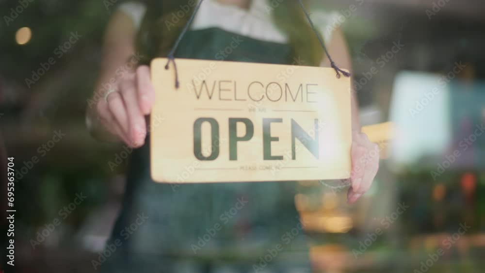 Woman entrepreneur with Open sign in cafe shop , small business concept