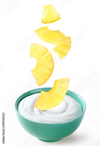 cream sour in ceramic bowl with pineapple pieces