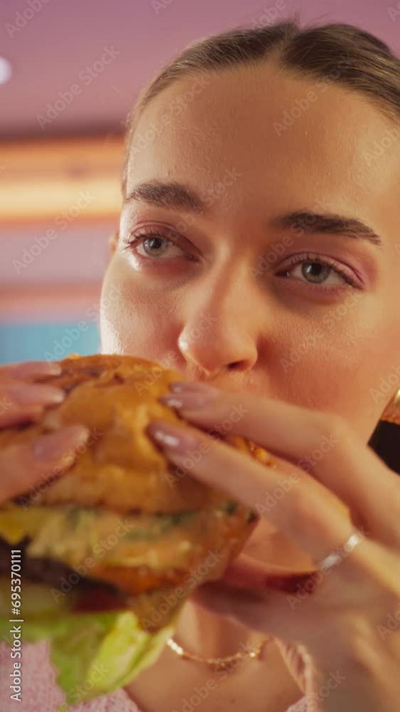Vertical Screen: Tracking Slow Motion Portrait of a Woman Who is Enjoying a Delicious Hamburger at Home. Colorful Setting For a Happy Female Who Ordered Fast Food Delivery, Approving of High Quality Vertical Screen: Tracking Slow Motion Portrait of a Woman Who is Enjoying a Delicious Hamburger at Home. Colorful Setting For a Happy Female Who Ordered Fast Food Delivery, Approving of High Quality