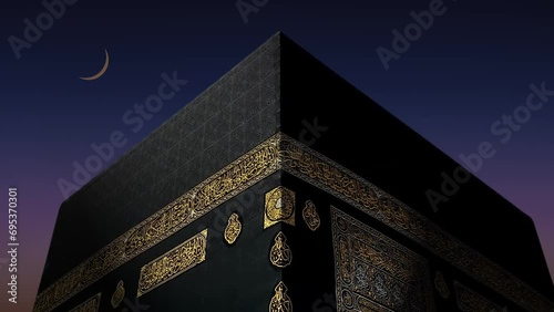 Mecca Saudi Arabia: Crescent moon rises on the Kaaba. Holy mosque of Makkah With moon rising in the sky. Haram Mosque minaret in a cloudy evening. Close up shot written in Arabic: 