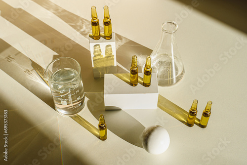 Medical ampoules close up. Many ampoules. Glass ampoules on the table. Scattered ampoules with medicine. Serum for healthy scalp.
 Laboratory, medical glass, container
