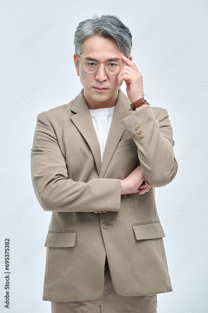 A middle-aged man in a suit expresses various emotions through facial expressions and hand gestures. A middle-aged man in a suit expresses various emotions through facial expressions and hand gestures.