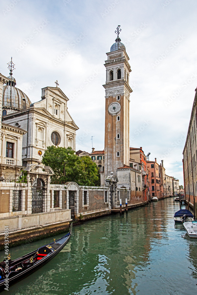 ride a gondola along the Venice canal near the clock tower. trips