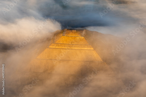 From above view of pyramid slope with fog photo