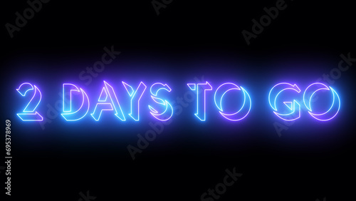 2 Days To Go neon glowing text illustration. Neon-colored 2 Days To Go text with a glowing neon-colored moving outline on a dark background. Technology video material.