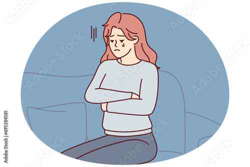 Upset woman crying sitting on couch because of breakup with boyfriend or death of loved one. Unhappy girl in casual clothes with arms crossed is going through after losing job. Flat vector image