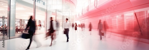 Blurred motion of people walking through shopping center