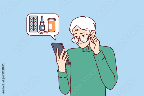 Elderly man orders medicines for home delivery using mobile phone from pharmacy application. Pensioner reads recommendations of ministry of health on use of medicines to treat diseases.