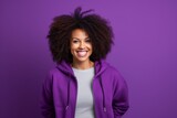 Portrait of a merry afro-american woman in her 30s wearing a zip-up fleece hoodie against a soft purple background. AI Generation