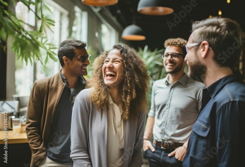 a group of businesspeople or coworkers laughing during a coffee break. concept of work life with a pleasant and comfortable atmosphere. generative AI photo