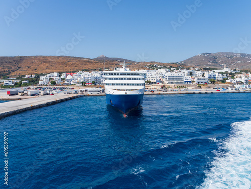 A large cruise ship in sea port of Tinos island in Greece photo