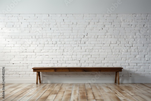  a wooden table sitting on top of a hard wood floor in front of a white brick wall with a wooden floor and a white painted brick wall in the background.