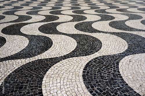 Wavy Pattern of Mosaic Tiles Pavement in Lisbon, Portugal.