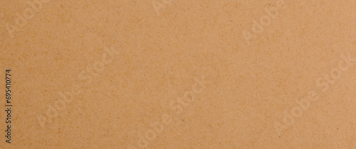 Brown craft paper texture background or cardboard surface for design