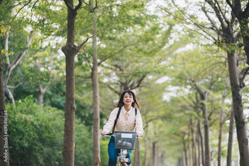 Asian woman renting shared bicycle in city